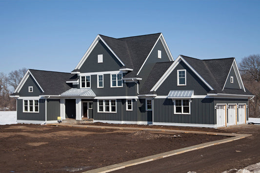 A large house with grey James Hardie cladding panels